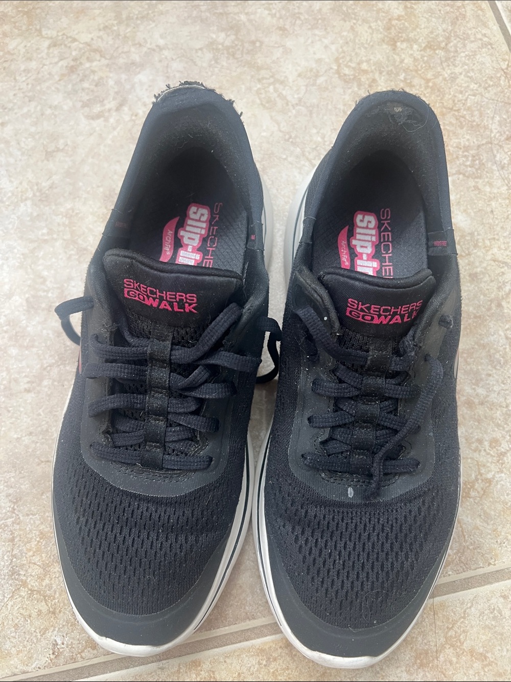Used Skechers GOwalk Women's Black Athletic Sneakers with Pink Branding.
